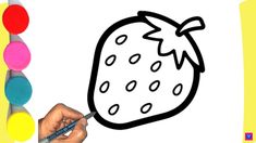 a person is drawing a strawberry with markers