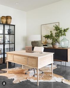 a wooden desk with a laptop on top of it