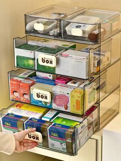 the drawers are organized with clear plastic bins and labels for different types of items