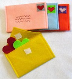 three small pieces of fabric with hearts in them