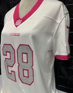 a women's nike football jersey on display