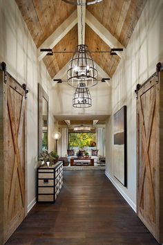 the inside of a house with wood floors and sliding doors