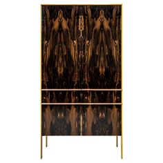 an art deco cabinet with mirrored doors and gold trim