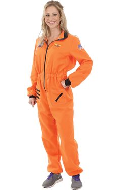 a woman in an orange jumpsuit posing for the camera with her hands on her hips