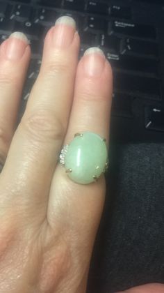 "Vintage 14k Gold 18ct Pale Green Jadeite Jade Statement Oval Diamonds Ring Sz 8 Offered here is a vintage 14k gold big oval 18ct pale white green jadeite .08ct diamond ring in a size 8. The oval, prong set stone measures approx. 3/4\" x 5/8\", and is flanked by four small diamonds on either side. Inside is marked 14K. Ring is not signed. The correct color of the jadeite is in the light box. The color on the fingers is not correct. Just wanted to show the big size on the fingers. This ring tests Elegant Green Opal Oval Ring, Oval Jade Ring For Wedding, Oval Jade Wedding Ring, Oval Jade Jewelry For Anniversary, Oval Jade Ring Fine Jewelry, Fine Jewelry Jade Oval Ring, Oval Jade Rings For Anniversary, Jadeite Ring, Pale White