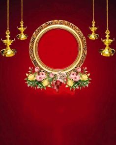 a gold frame with flowers and candles on a red background