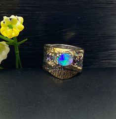 Australian Opal Gemstone Ring in sterling silver with gold accents size 5 1/2 Materials: Silver 925, Australian Opal, Amethyst, Topaz, Tourmaline  Face of the ring: Height-15mm,Width-7mm(stone), Band-10mm Please note: Colors may vary slightly due to monitor display settings. Items in the photograph are not actual size. Closeup photos are taken. Please read the measurements. PLEASE READ SHOP ANNOUNCEMENT FOR RETURNS AND EXCHANGES THANK YOU FOR LOOKING and SUPPORTING HANDMADE JEWELRY CARE: Please Unique Multi-stone Opal Ring In Gold, Unique Gold Opal Ring With Multi-stone, Spiritual Silver Opal Ring With Multi-stone, Unique Gold Opal Ring With Accent Stones, Artisan Silver Opal Ring With Multi-stone, Artisan Silver Opal Ring For Anniversary, Unique Opal Ring With Accent Stones As Gift, Silver Fusion Opal Ring For Anniversary, Silver Fusion Style Opal Ring For Anniversary