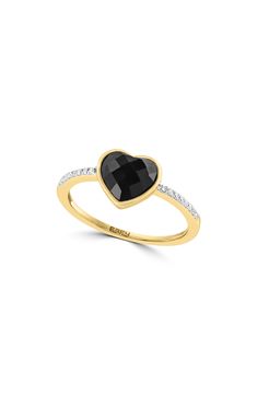 A black onyx heart centers a romantic 14-karat yellow-gold ring finished with a diamond-embellished band for dainty sparkle. 1/4" band width Total onyx weight: 0.85ct. Total diamond weight: 0.06ct. Color: H–I Clarity: I2 14k gold/onyx/diamond Made in the USA Diamond Guide Black Diamond Jewelry For Valentine's Day, Valentine's Day Black Diamond Jewelry, Black Diamond Heart-shaped Jewelry, Black Heart-shaped Diamond Jewelry, Black Ring For Valentine's Day Formal Occasion, Black Rings For Valentine's Day Formal Occasion, Black Rings For Valentine's Day Formal Events, Elegant Black Heart Ring For Weddings, Black Heart Cut Rings For Valentine's Day