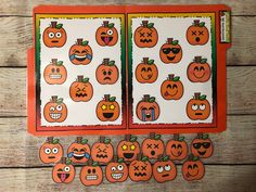 an orange and white halloween themed activity board with pumpkins on it, surrounded by cut outs