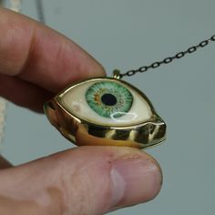 Green Big Eye Pendant, Evil Eye Talisman Pendant, Glass Green Eye Necklace, Evil Eye Necklace, Eye Jewelry, Gift Idea, Handmade Eye Jewelry My eye designs can be made specifically for your eyes, you need to take a beautiful iris photo for us. Then we can customize it for you. You can also add or remove blood details to our eye designs. You can write this in the order notes. Please send me a message after ordering. I can do as you wish. A quasi-universal symbol of protection, the evil eye is refe Brass Evil Eye Jewelry For Gifts, Evil Eye Brass Jewelry As A Gift, Brass Evil Eye Jewelry As A Gift, Symbolic Eye-shaped Jewelry Gift, Eye-shaped Amulet Necklace As Gift, Amulet Eye Necklace Gift, Unique Eye-shaped Jewelry For Gifts, Handmade Vintage Necklace For Good Luck, Handmade Symbolic Green Necklace