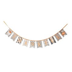 an orange and gray plaid banner with the words happy halloween on it, hanging from a string