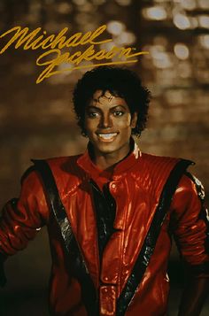 michael jackson in red leather jacket with black suspenders and gold lettering on his face