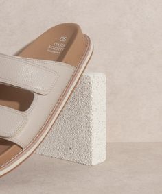 A classic sandal redesigned for better comfort and softer wear Man made Upper Insole . Rubbed heel with 1" platform. Bottom of the sole: 5.25" Comfortable Slip-on Sandals With Textured Sole, Beige Slides With Textured Footbed And Round Toe, Comfortable Beige Leather Sandals, Comfortable Open Toe Mules With Textured Footbed, Beige Cushioned Sandals With Round Toe, Beige Slip-on Sandals With Textured Footbed, Beige Slide Mules With Cushioned Footbed, Beige Slip-on Sandals With Textured Sole, Beige Slides With Cushioned Footbed And Round Toe