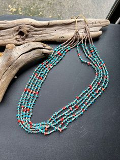 This is a gorgeous Native American Navajo 5 strand handstrung necklace. The Artist is A Tallis, this beauty is 24.5" of materials, if you include the tie backs 35.5" is the length end to end. It's made from natural Turquoise, Mediterranean Coral and Shell Heishi.  This is a lovely necklace to add to your  jewelry collection, or to give as a wonderful gift for a friend!! *Please look at all photos closely. Thanks for dropping by          NorthWestTradinCo Hand-strung Multi-strand Bohemian Turquoise Necklace, Bohemian Multi-strand Hand-strung Turquoise Necklace, Turquoise Multi-strand Hand-strung Jewelry, Southwestern Multi-strand Turquoise Beads, Handmade Multi-strand Turquoise Necklace, Multi-strand Turquoise Gemstone Beads Necklace, Multi-strand Turquoise Necklace For Jewelry Making, Multi-strand Turquoise Gemstone Beads Necklace For Jewelry Making, Southwestern Multi-strand Turquoise Necklace For Jewelry Making