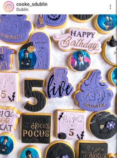 some cookies are decorated with the names of five different people and have pictures on them