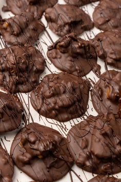 chocolate covered cookies are sitting on a tray