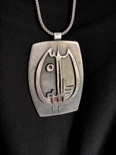 WOW! Look at this modernist pendant with chain. Made of pewter, designed in the 70s, and handmade by de Passille Sylvestre.  It measures 2 1/8" wide and 3" long. A substantial piece! The chain measures 28 1/2" long.  The colors of the enamel are blue, red, purple and pale yellow.  These designers are from Quebec, Canada and their pieces are much sought after.  Please note that we now ship to the USA and Canada ONLY Please view the ENTIRE listing carefully as we don't offer returns,exchanges or c Heavy Chain, Pendant With Chain, Long A, Quebec Canada, The 70s, Pale Yellow, Red Purple, Pendant Necklaces, Jewelry Necklace Pendant