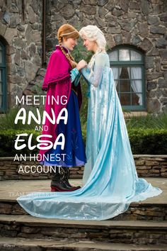 two women dressed as frozen princesses standing next to each other in front of a stone building