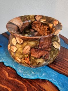 a glass bowl sitting on top of a wooden table