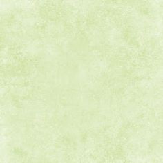 a light green wallpaper with some white paint on it