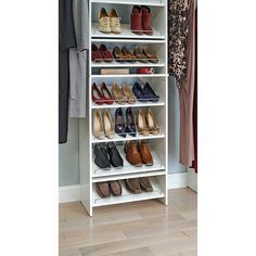 a white shoe rack filled with lots of shoes