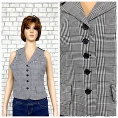 womens Vest Vintage womens plaid Vest Black white Vest Houndstooth Vest Checkered Vest  waistcoats Retro Vest Halter Vest S 0В height of the woman in the photo - 180 cm Please refer to photos for details of condition.  Condition: good vintage Measurements: Length: 50 cm/ 19.7" Bust: 88 cm/ 34.7" Waist: 75 cm/29.5"  Size: S note The color on the pictures may vary due to monitor settings and light reflections. Ready to ship Please do not hesitate to contact with me for any questions. Thank you for Fitted Plaid Vest For Winter, Fitted Plaid Outerwear With Buttons, Victorian Vest, Houndstooth Vest, Checkered Vest, Checker Vest, Retro Vest, Purple Vest, Halter Vest