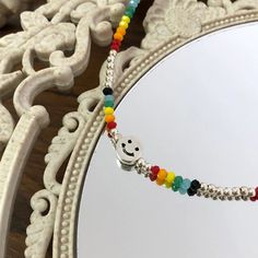 This Colorful Beaded Necklace With Happy Face is the perfect item for your summer look!Material: BeadsColor: Picture ColorMeasurement:Length: 17" + 2" Smiley Necklace, Colorful Beaded Necklace, Necklace Y2k, Y2k Necklace, Y2k Jewelry, Velvet Ring Box, Seed Bead Necklace, Happy Face, Summer Look