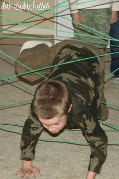 a young boy is crawling on the floor