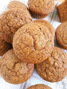 a pile of muffins sitting on top of a table