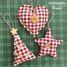 two red and white checkered christmas ornaments with buttons on them, one in the shape of a heart