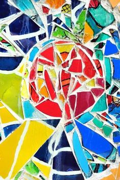 an abstract painting made up of colorful pieces of stained glass and various colored strips of paint