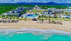 an aerial view of the resort and beach