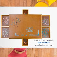 a wooden table topped with lots of puzzle pieces