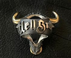 🔱 Embrace the strength, power, and spiritual guidance of the Hell Bull ring. Rise up to any challenge with this extraordinary piece of jewelry loaded with unapologetic Mortis Ores DNA and created with meticulous craftmanship. Designed to honor the fight through any obstacles, this Hell Bull ring will give you the bullish spirit to rise and win it head on. Make it a symbol of your strength and wear it as a statement! 🔱 The ring weighs at approximately 75 grams of 925 sterling silver with 22K go Symbolic Hand Forged Rings For Collectors, Hand Forged Symbolic Rings For Collectors, Custom Black Jewelry With Hardware For Gift, Black Jewelry With Custom Hardware As Gift, Black Engraved Rings For Ceremonial Occasions, Black Engraved Ceremonial Rings, Ceremonial Black Engraved Rings, Custom Engraved Black Rings, Custom Black Engraved Rings