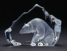 a clear glass sculpture of a polar bear