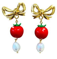 Add a touch of La Dolce Vita to your Bunx collection and let your inner Tomato Person shine. The spring ring attachment allows the tomato charm to be clipped onto most Bunx necklaces, bracelets, or earrings. Details ✱ 18k gold coated brass ✱ Enamel coating ✱ Baroque pearl Gold Plated Clip-on Earrings For Gifts, Red Enamel Clip-on Jewelry, Yellow Gold Clip-on Jewelry For Gift, Clip-on Dangle Jewelry For Gifts, Gold Plated Clip-on Earrings As Gift, Gold Plated Clip-on Jewelry Gift, Gift Clip-on Dangle Jewelry, Bow Earring, Tomato Girl