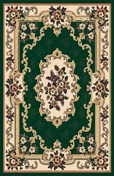 a green and white rug with an ornate design on the center, surrounded by flowers