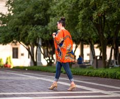 "Don't just follow the crowd, Lead the crowd with Priceless Cultures' uniquely designed Dashiki Kimono and you're guaranteed to have all eyes on you. ONE SIZE FITS ALL Kimono. And the style is oversized!! This kimono can fit a US Size 0 to 24, Can fit a small to Extra Extra Large to 3X. Dashiki Kimono is opened in the front NOTE: This listing does not include the top and model's denim pants. You can rock this with a cinch belt to give a different look. Rock with Pants, leggings, skinny jeans, re African Clothing Women, Kimono Ankara, African Kimono, African Couple, Boho Plus Size, Plus Size Kimono, Cinch Belt, Kimono Jacket, African Clothing