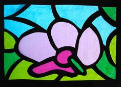 a close up of a stained glass window with flowers