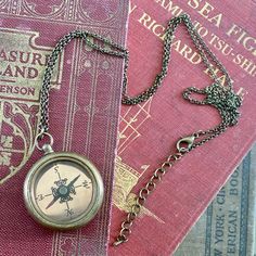 Compass on 28 inches of antiqued brass chain. Can adjust chain length by request. Available on plain chain or chain with filigree centerpiece. Each purchase comes in a gift box. Brass Compass Design Round Pendant Necklace, Bronze Compass Design Jewelry Gift, Bronze Compass Design Jewelry As Gift, Bronze Compass Design Jewelry For Gifts, Antique Finish Medallion Necklace As Gift, Antique Finish Medallion Necklace Gift, Vintage Necklaces With Compass Design And Round Pendant, Vintage Round Pendant Necklaces With Compass Design, Vintage Compass Design Necklaces With Round Pendant