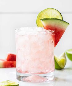 a watermelon and lime drink in a glass with ice