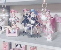 some anime figurines are on a shelf in a room with other toys and decorations