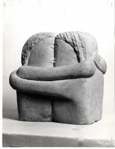 an old black and white photo of a large stone sculpture with hands on it's back