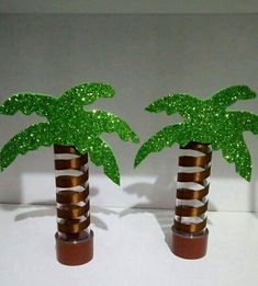 two palm trees made out of plastic bottles