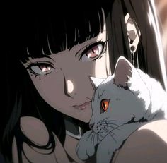 a woman holding a white cat in her arms