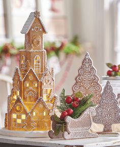 christmas decorations are displayed on a table