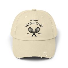 a white hat with the words tennis club on it and two crossed racquets