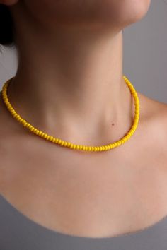 Simple bright beaded choker necklace with yellow czech glass beads, strong double nylon thread, silver tone clasps, silver tone lobster clasp and stainless steel adjustable length chain. Perfect for everyday wear or a pretty gift for someone special! You can wearing it with other chokers, chain necklaces or alone! Total length of necklace is about 42 cm or 16.5 inches and 4 cm of adjustable length chain. NOTE: in my store you can also find similar necklaces in other colors as in the last photo. Yellow Seed Bead Necklace, Yellow Bead Necklace, Yellow Beads Necklace, Simple Short Necklace, Small Diamond Necklace, Yellow Beaded Necklace, Collar Verde, Simple Beaded Necklaces, Bright Necklace