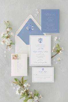 the wedding stationery was done in blue and white