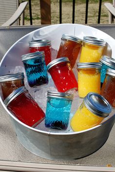 an image of some drinks in jars on a table